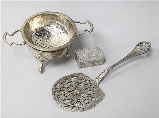 A, 1920s Asprey & Co silver tea strainer and stand, a German silver server and a sterling silver pill box.